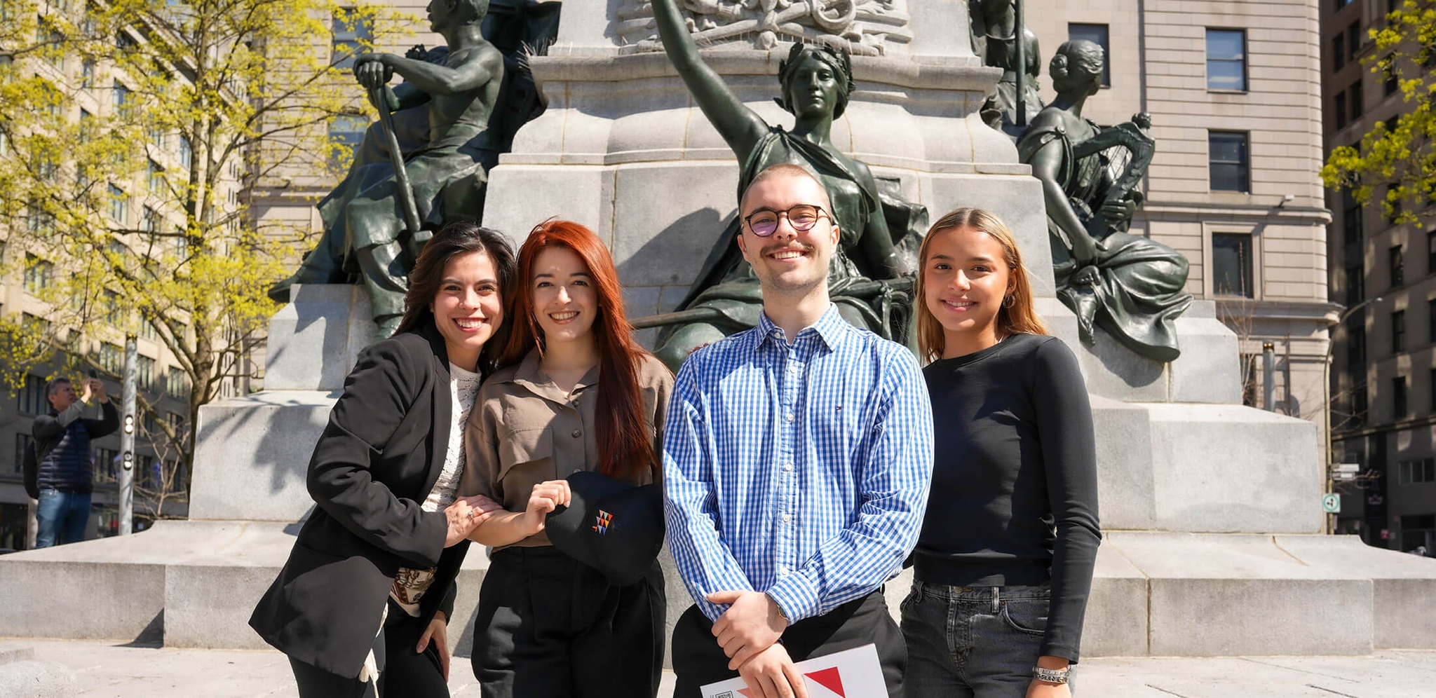 group of students standing outside the campus