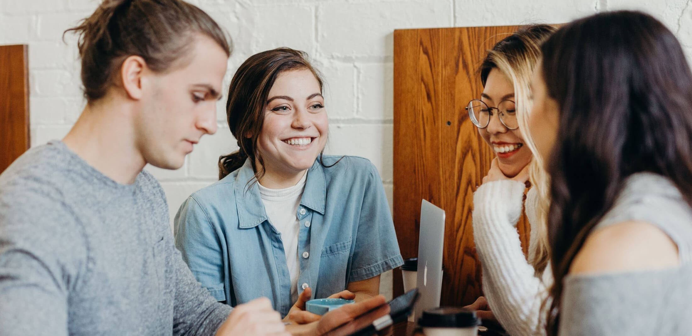 group of students chatting and smiling